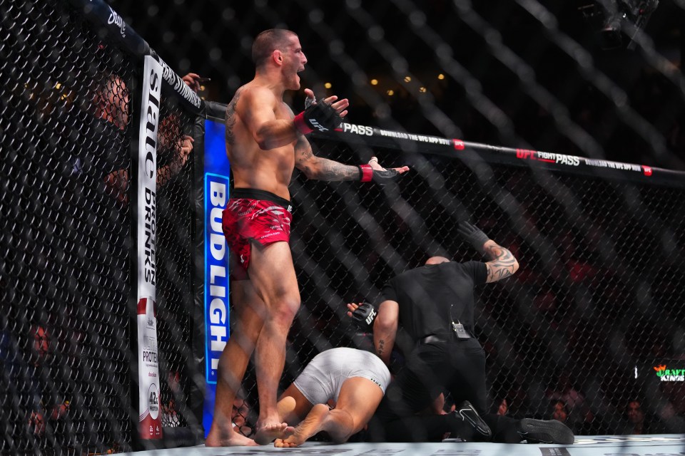 Marc-André Barriault celebrating a knockout victory in a UFC match.