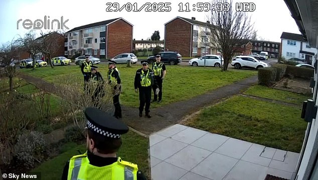 JANUARY: CCTV shows six uniformed police officers descending on a couple's home over messages they sent in a parent WhatsApp chat