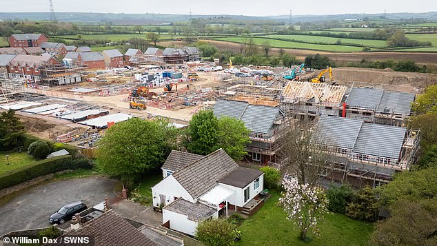 Drone shots showing the new housing estate next to the couple's home