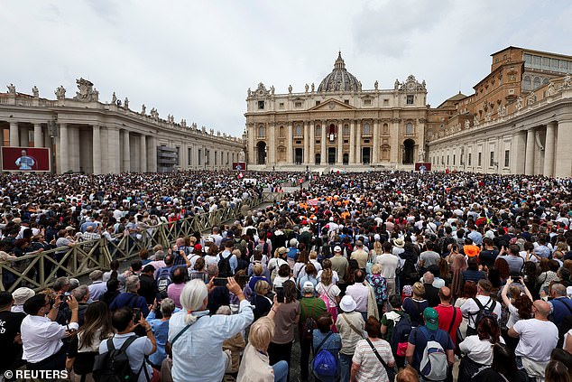Faithful attend a Regina Caeli prayer, led by Pope Leo XIV from the central balcony