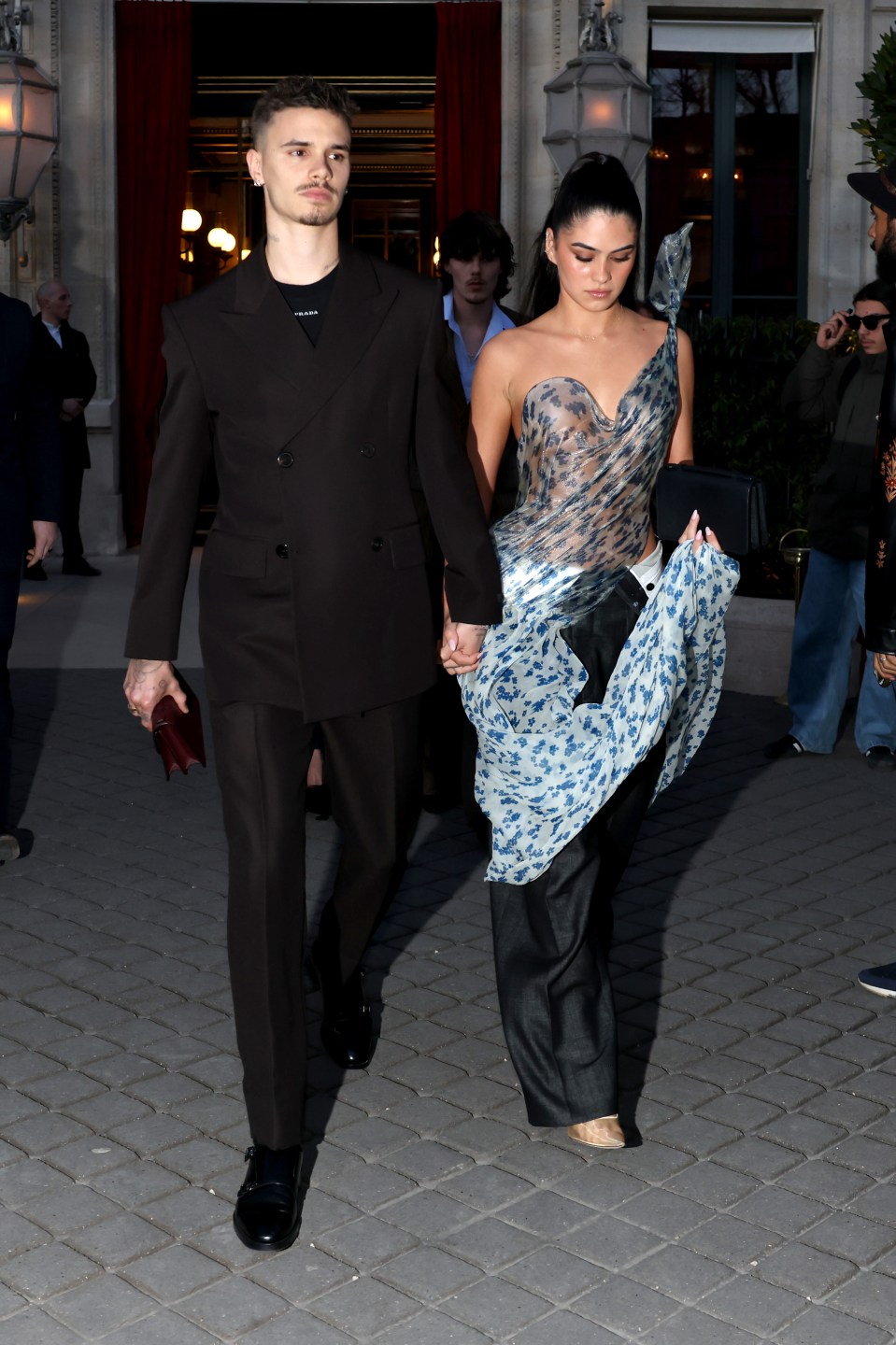 Romeo Beckham and Kim Turnbull at Paris Fashion Week.