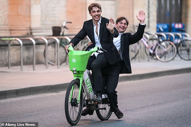 Some chose to cycle home, with one cheerful pair beaming and waving at the camera as they pedaled away