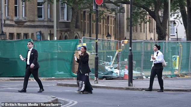 Revellers donned ball gowns and bow ties as they ambled through the town's historic streets following the Star Crossed Lovers themed event at Balliol College. One trio of stragglers were pictured munching on sandwiches as they tried to refuel themselves for the journey back
