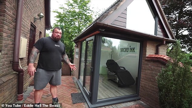 The former Strongman showed off a glass-fronted shed that he said would used by his wife Alex, who is a tattoo artist