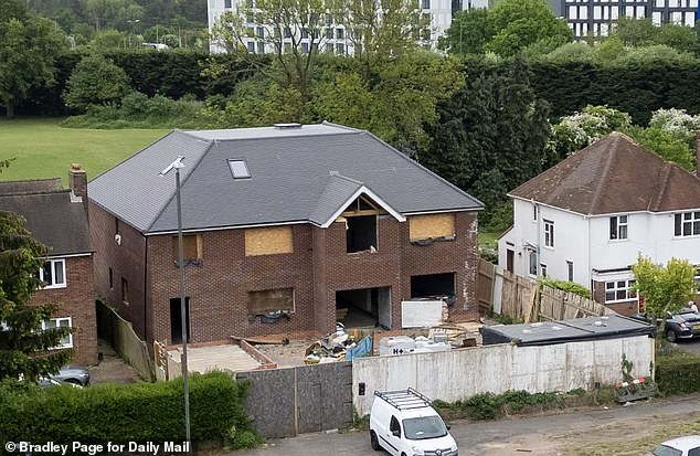 Picture shows the house which was issued with an enforcement notice and surrounding properties