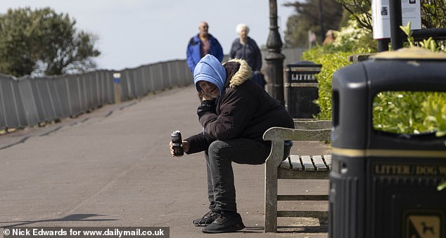 CLACTON: A man sits on a bench by the seafront in Clacton