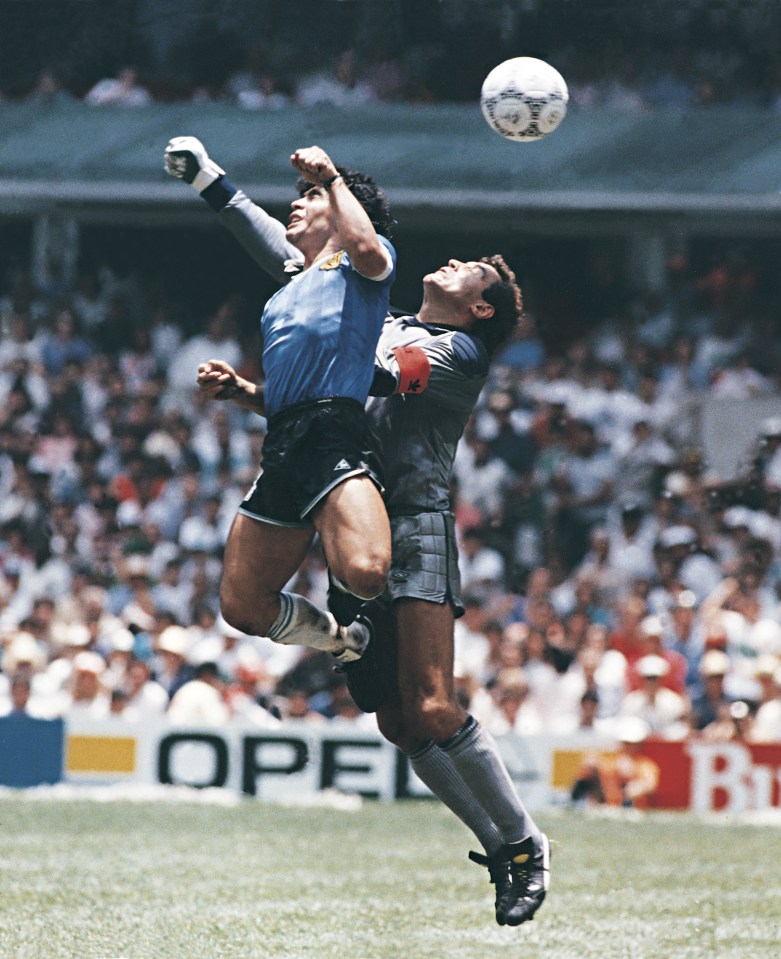 Photo of Diego Maradona scoring a goal with his hand during a 1986 World Cup quarterfinal match.