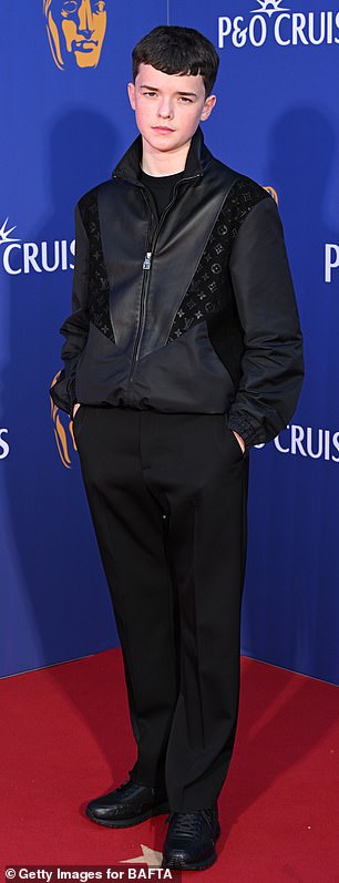Meanwhile lead actor Owen, 16, who played Jamie Miller, looked very chic on the red carpet as he arrived at the event in a Louis Vuitton bomber jacket