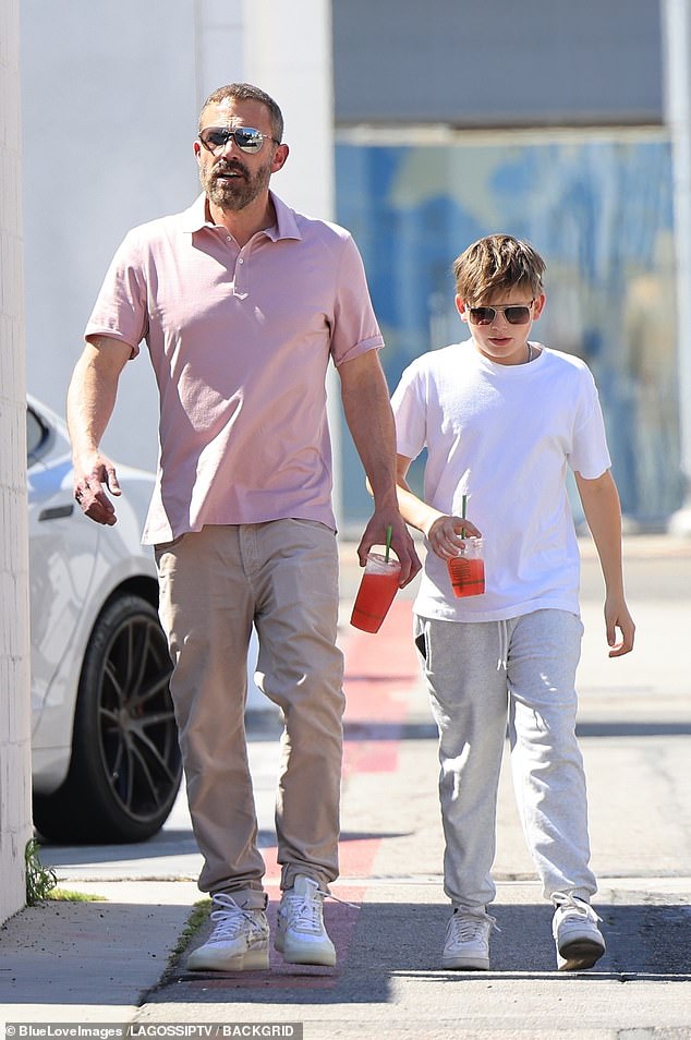 Amid his ex and his friend's romance, he enjoyed a shopping day and picked up refreshing juices with his son
