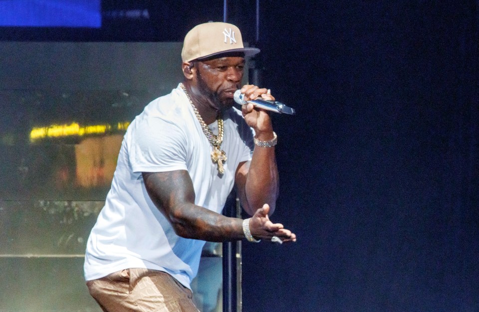 50 Cent performing on stage.