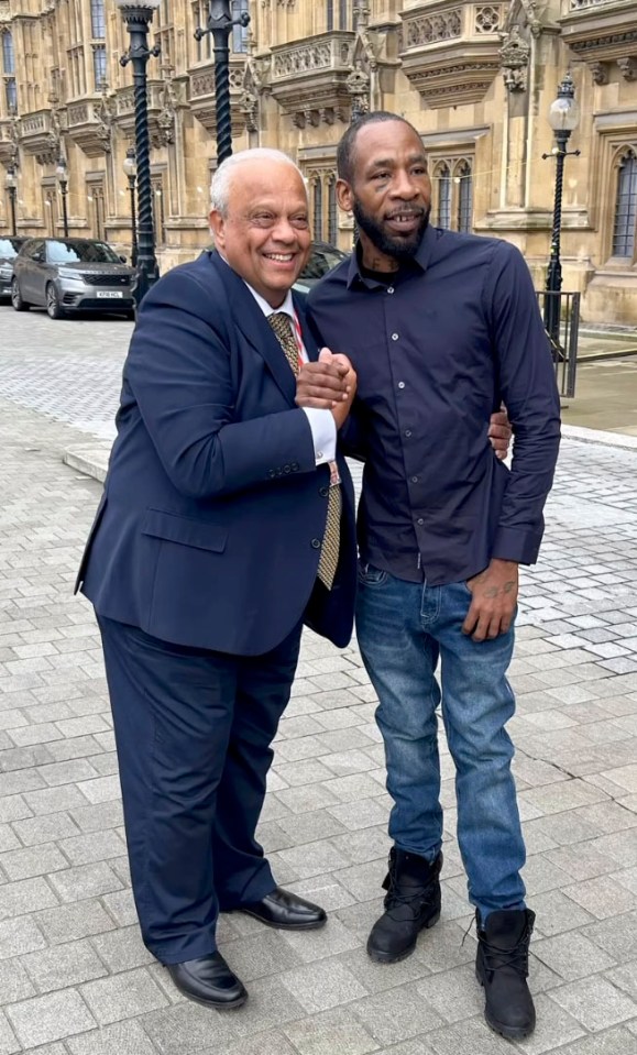 Rapper Bang Em Smurf meeting with Lord Michael Hastings outside the Houses of Parliament.