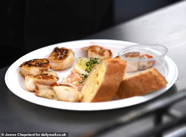 A plate of freshly caught scallops grilled by the sea front at MacGillivrays Seafood Grill