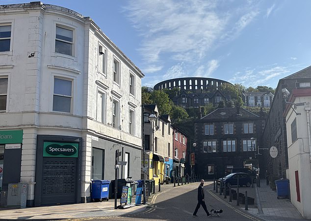 Tourist attraction McCaig¿s Tower seen peeking through the buildings on the high street