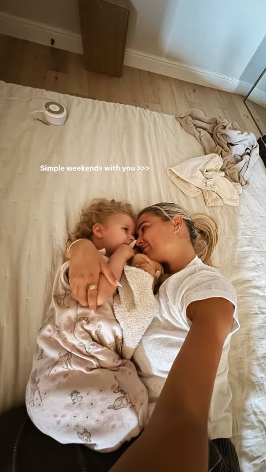 Molly Mae Hague and Tommy Fury's daughter cuddling in bed.