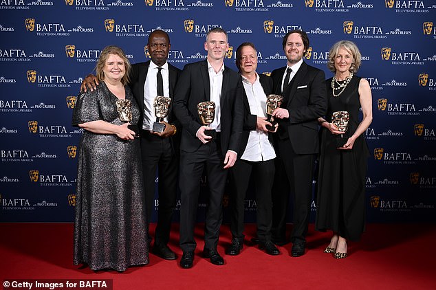 (L-R) Emma Parkins, Clive Myrie, Ed Stobart, Denis Minihan, Jane Magowan and members of the cast and crew pose with the Daytime Award for Clive Myrie's Caribbean Adventure