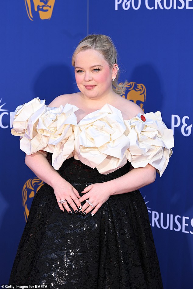The Bridgerton icon commanded attention in the elegant number which featured a dramatic floral embellishment on her neckline