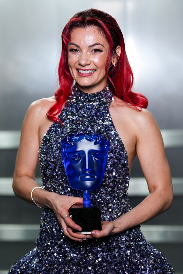 Dianne Buswell holding a BAFTA Television Award.