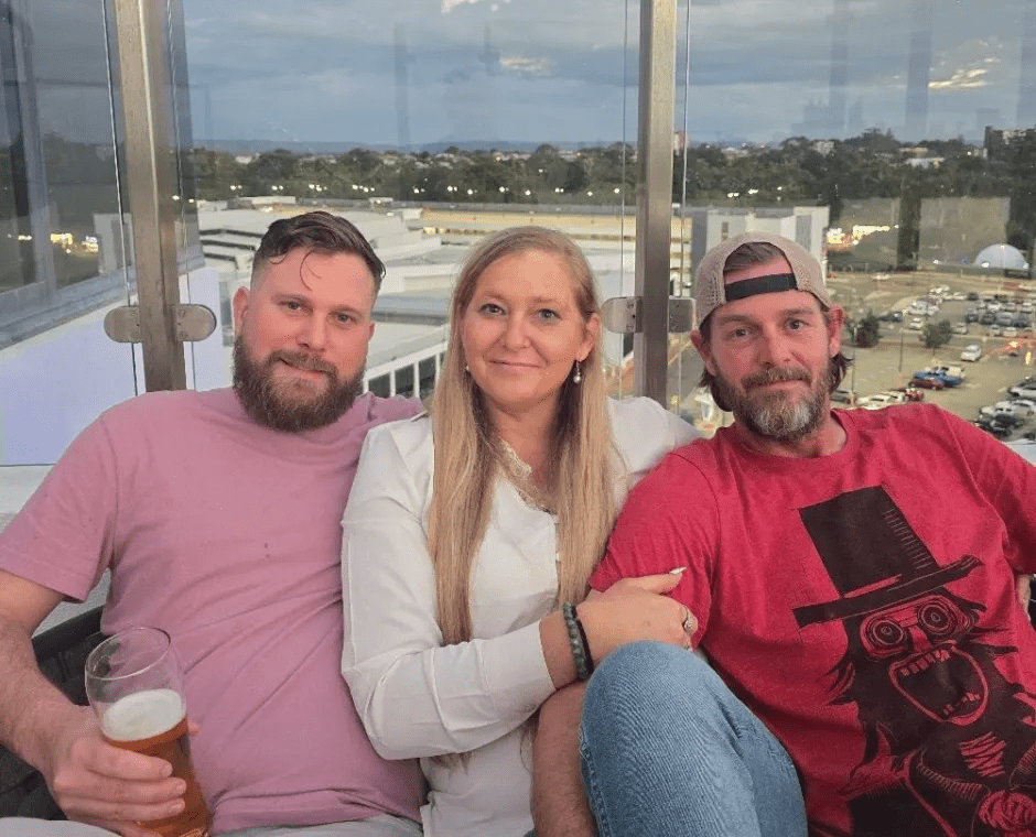 Three people posing for a photo.