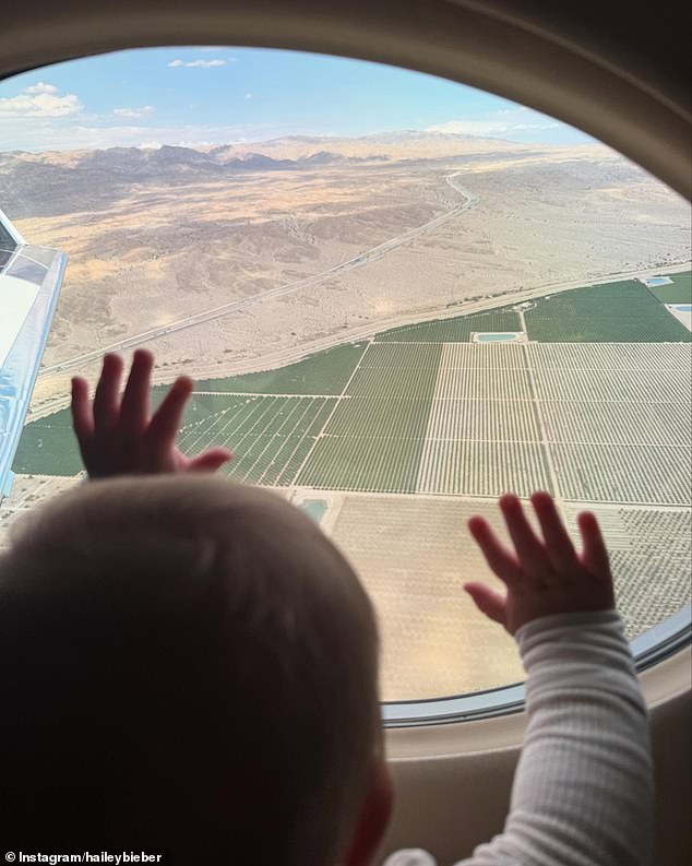 Jack gazed out upon some farmland in the desert while flying on a jet in one striking photo