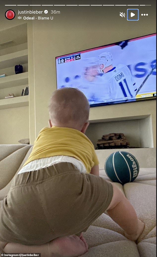 Jack seemed to be getting into hockey at an early age as he watched the game with his dad