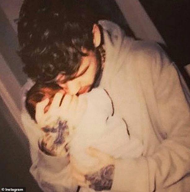 The pair have been fiercely protective over Bear's privacy, never showing his face on social media (pictured: Liam with Bear as a baby)