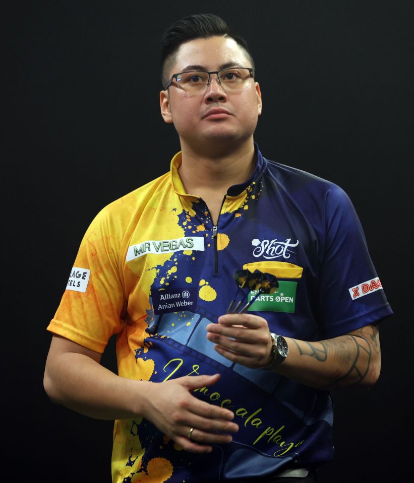 Rowby-John Rodriguez at a darts tournament.