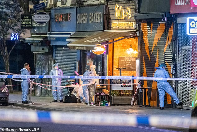 A nine-year-old girl was shot in the head in the crossfire from a targeted shooting outside this cafe in Hackney last year