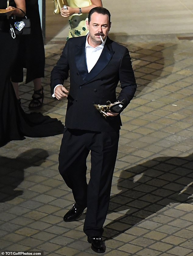 The footless stars joined a throng of other well-known faces wearily heading home after the bash, with BAFTA winner Danny Dyer seen puffing on a cigarette after turning the air blue during his acceptance speech