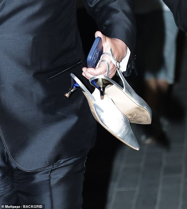 The Gavin and Stacey star was seen gripping onto his friend's silver slingbacks as they walked together