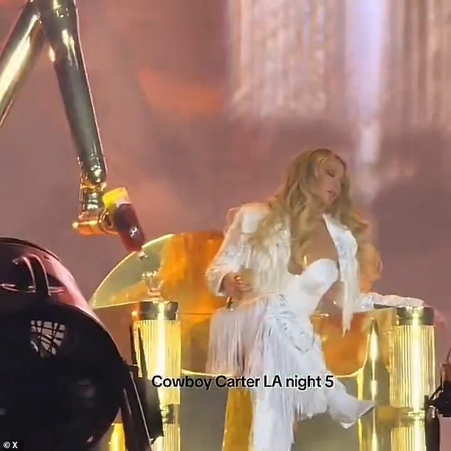 During one section of the concert at Inglewood's SoFi Stadium, Beyoncé took a break to sit on a large gold thrown as a robotic arm that wouldn't have been out of place in a factory attempted to pour a bottle of liquor into her glass on one of the throne's arms