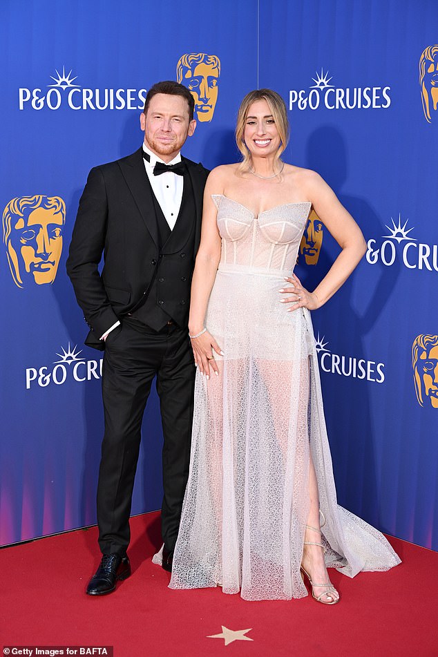 On Sunday, Stacey turned heads on the red carpet after she re-purposed her wedding dress for the ceremony [pictured with husband Joe Swash]