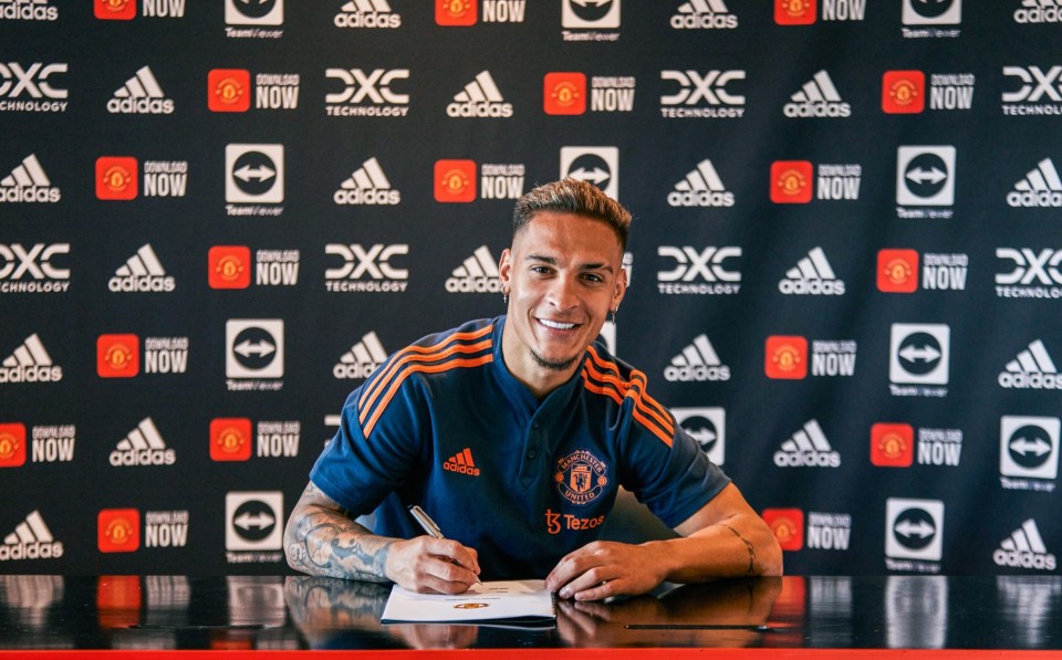 MANCHESTER, ENGLAND - SEPTEMBER 01: New Manchester United signing Antony signs for the club at Carrington Training Ground on September 01, 2022 in Manchester, England. (Photo by Manchester United/Manchester United via Getty Images)