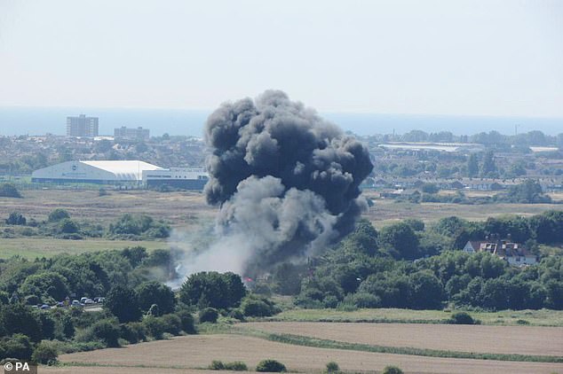 A vintage fighter jet crashed when it hit a road and burst into a fireball during a failed airshow stunt