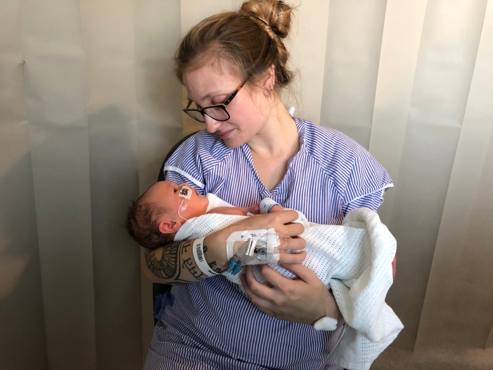 Gabi Simpson holding her newborn daughter Bea.