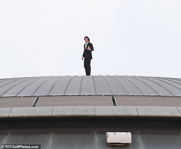 Cruise may have also been tying in his trip to the BFI IMAX's roof with an event Monday during which he will be honored with a BFI Fellowship, the highest honor from the UK film organization. The actor wore a dark suit and could be seen waving at fans