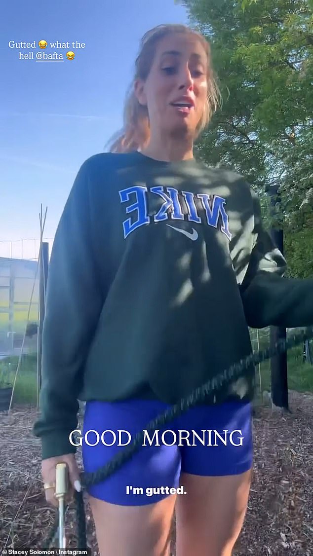 Dressed in a green Nike sweater and blue cycle shorts, Stacey watered her vegetable patch while expressing to her fans how she felt about the loss
