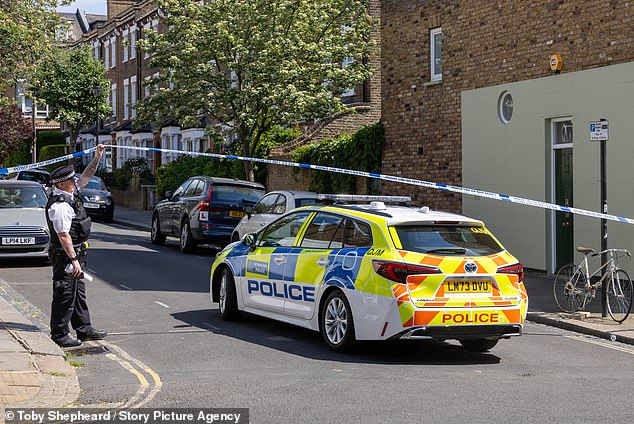 Pictured is a police cordon on the street where one of Sir Keir Starmer's homes caught fire
