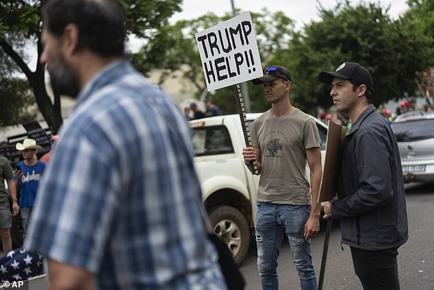 White South Africans demonstrate in support of Donald Trump in front of the US embassy in Pretoria, South Africa