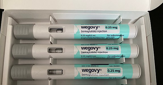 Lansing, KS USA - May 26, 2024. Wegovy weight loss medication, close-up of injectable pens in packaging. Semaglutide one month supply. Type 2 diabetes medication, anti-obesity drug, Novo Nordisk.; Shutterstock ID 2467323279; purchase_order: -; job: -; client: -; other: - 14678365