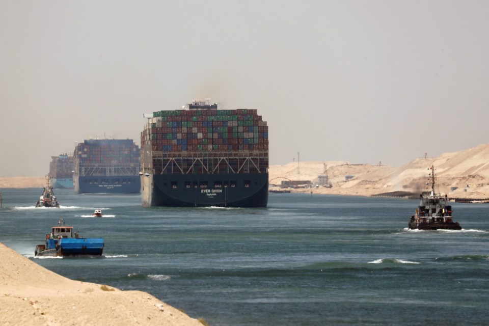 The Ever Given container ship and other vessels transiting the Suez Canal.