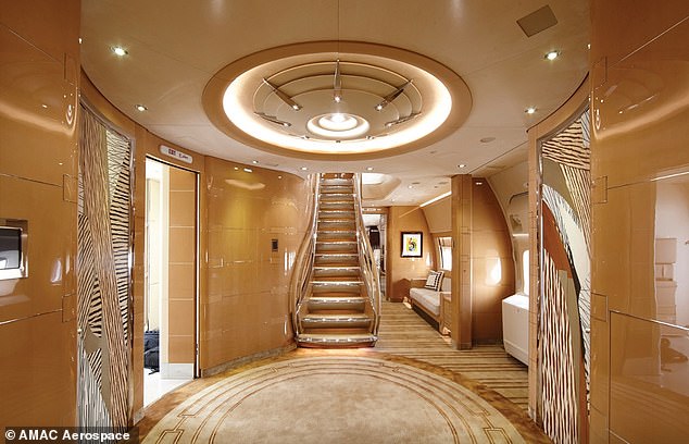 The various lounges, kitchens, and bathrooms are connected by a luxurious staircase (pictured). The plane is capable of carrying up to 90 VIP guests
