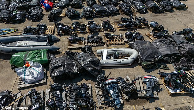 In this aerial view inflatable dinghies and outboard motors believed to have been used by illegal migrants to cross the English channel from France to England are stored in a Home Office compound on May 12, 2025 in Dover, England