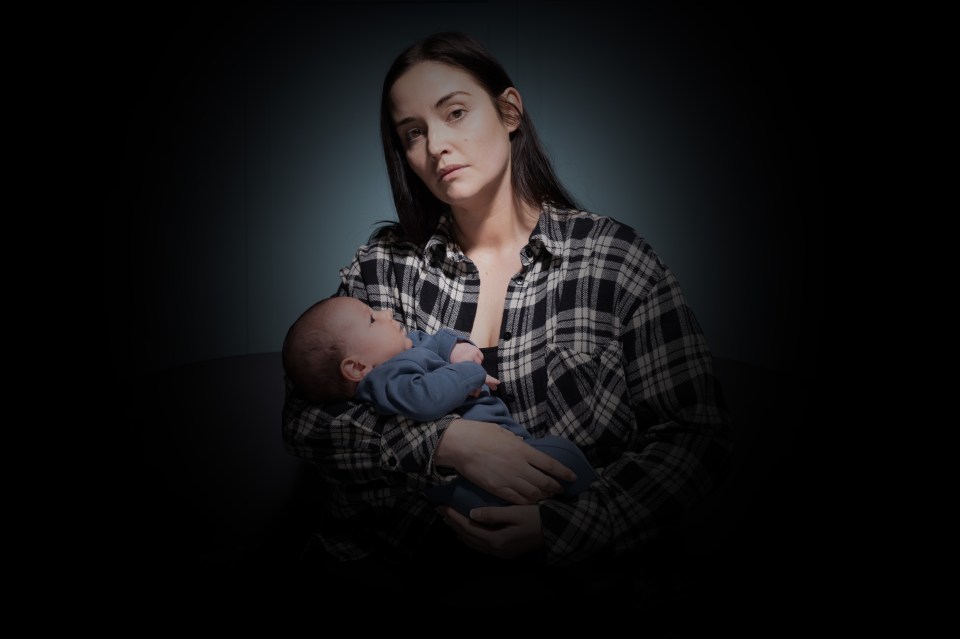 Jacqueline Jossa as Lauren Branning in EastEnders holding a baby.