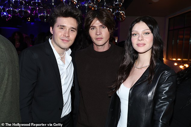 Nicola has grown up surrounded by the support of her six brothers, and previously revealed that it was actually her sibling Diesel who introduced her to Brooklyn (the couple are pictured with Nicola's brother Will in 2022)