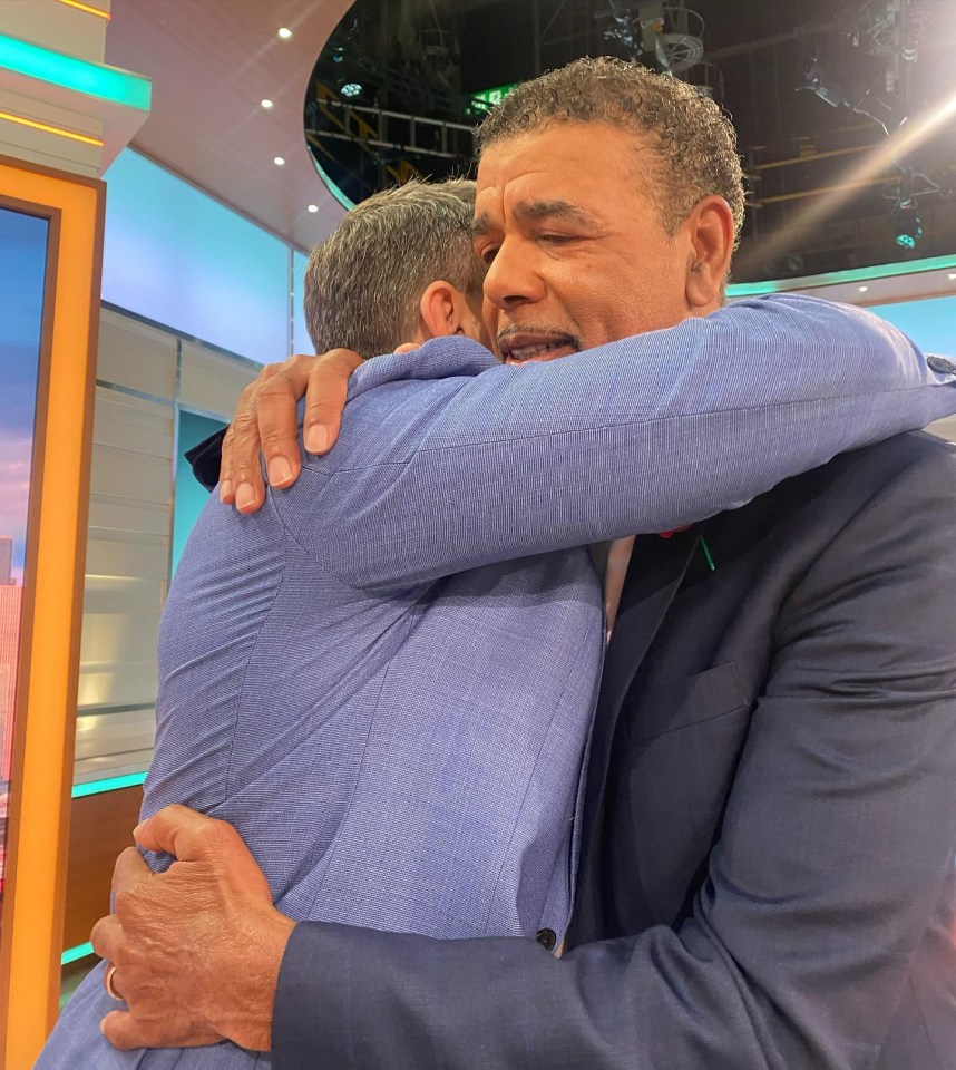 Ben Shepherd embracing Chris Kamara.