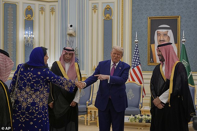 President Donald Trump gestures to Saudi Crown Prince Mohammed bin Salman as he greets Reema bint Bandar Al Saud, Saudi ambassador to the United States
