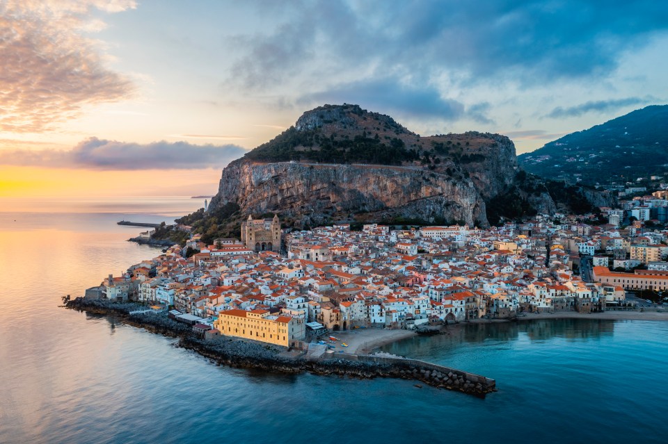 Aerial view of a coastal town at sunrise.