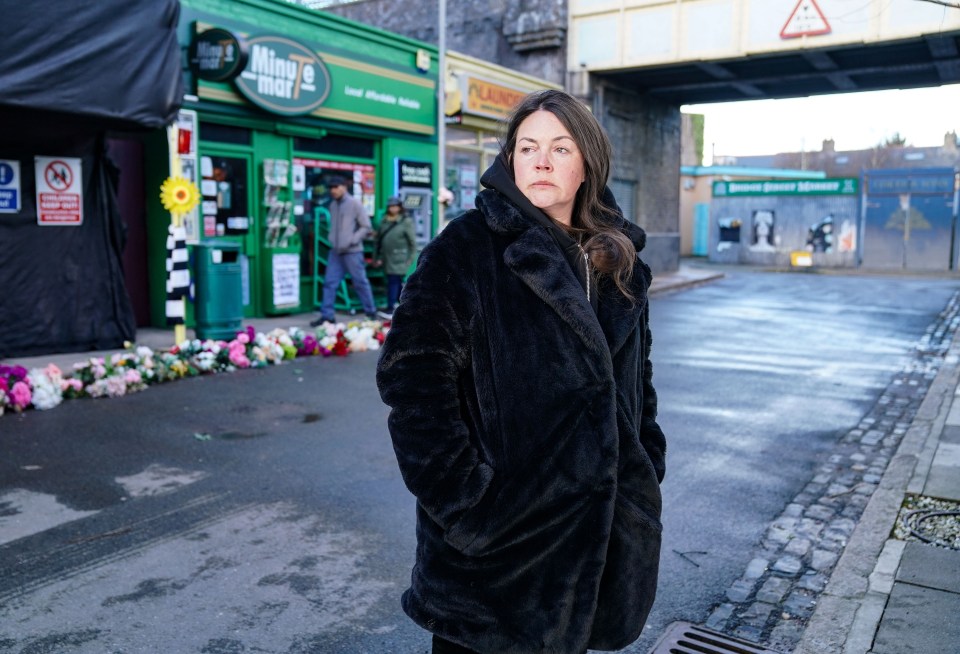 Stacey Slater from EastEnders on a street.