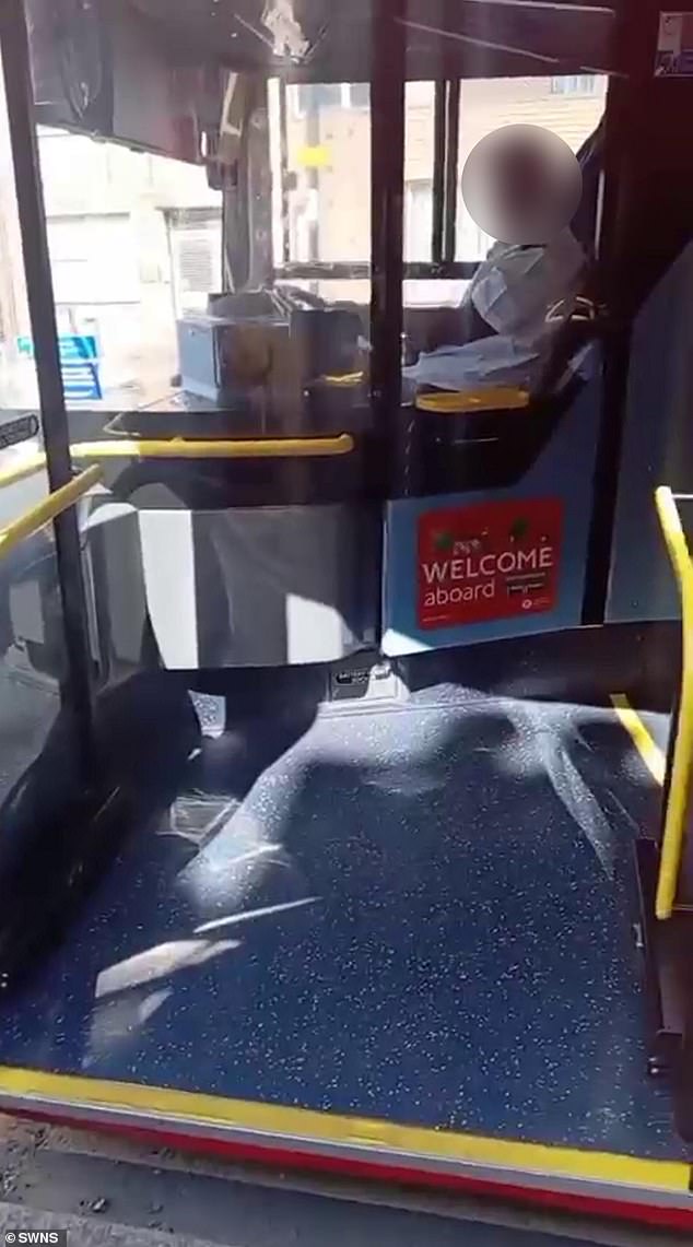 The male driver gestures for her to come to the front of the bus, telling her 'it's just a buggy' and asking her to 'bump it up' - before driving off