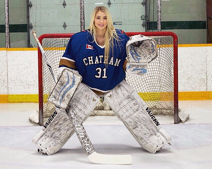 a hockey goalie with the number 31 on her jersey